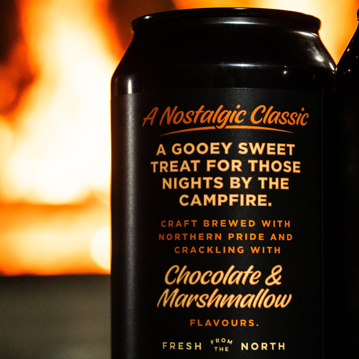 Black can with gold text against a fiery background